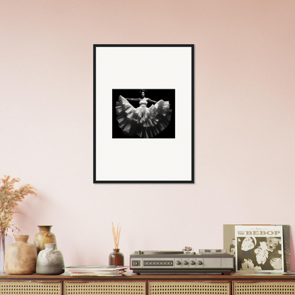 Framed black and white photograph of a dove with outstretched wings.