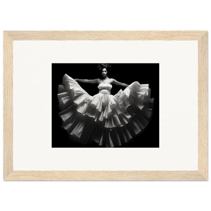 Black and white photograph of a dancer in a flowing, ruffled dress with outstretched arms.