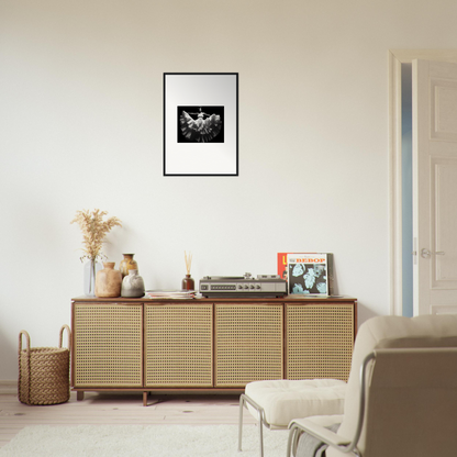 Wooden sideboard with cane-webbed doors and decorative items on top.