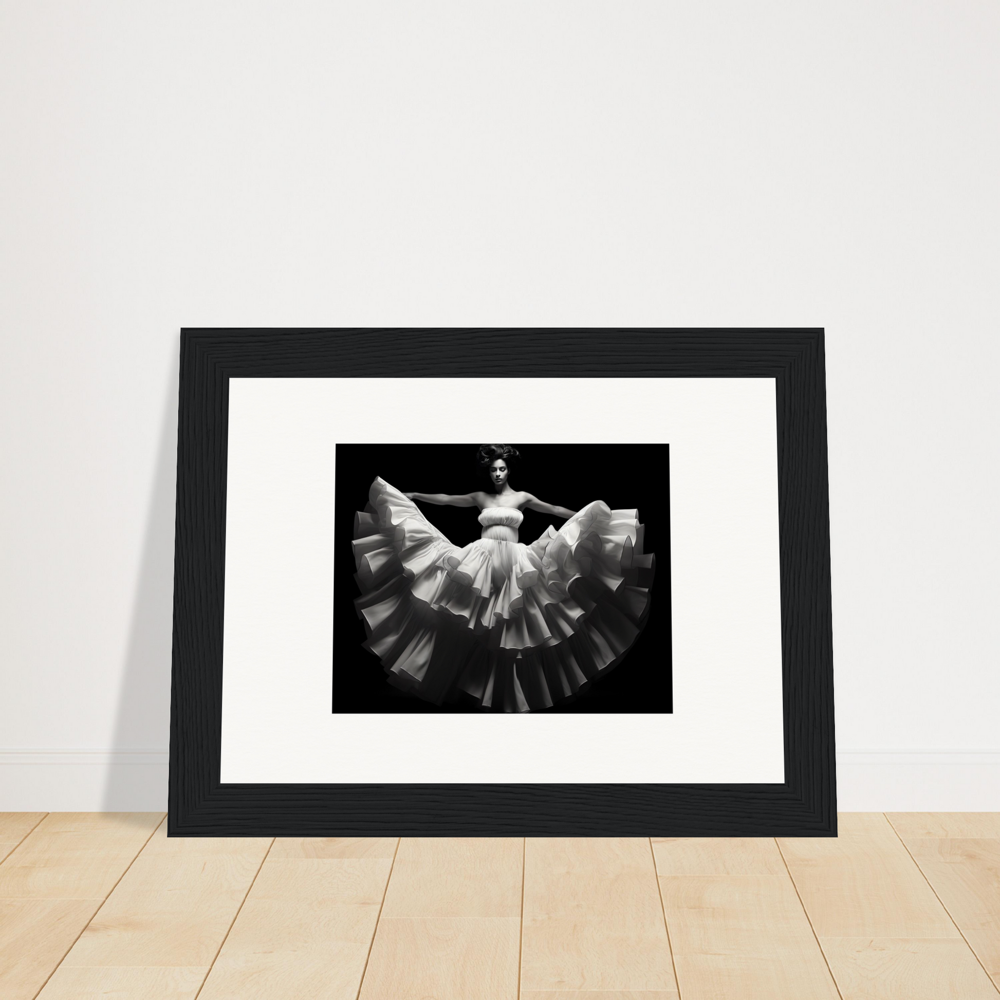 Framed black and white photograph of a dancer in a flowing dress.