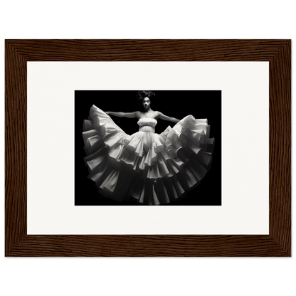 Black and white photograph of a dancer in a flowing white dress with a dramatically flared skirt.