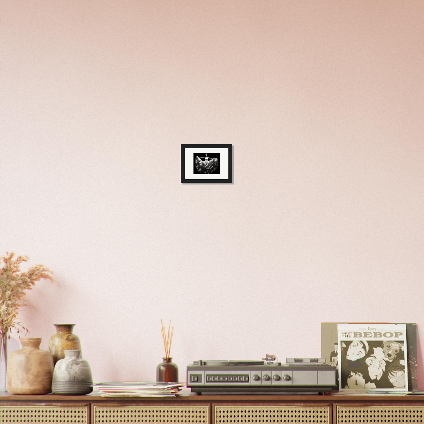 Wooden sideboard or console table displaying various decorative objects and a vintage stereo system.