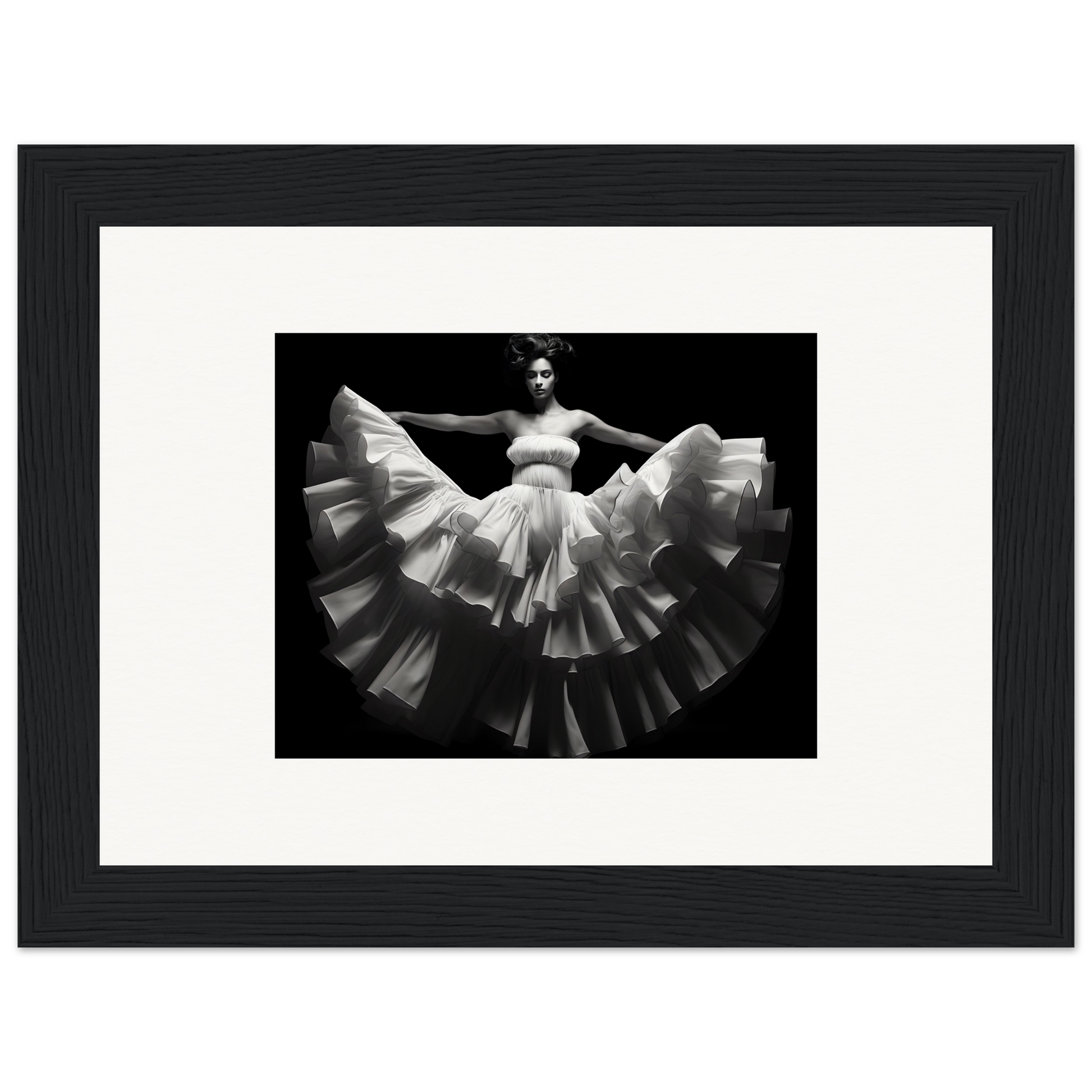 Black and white photograph of a dancer in a flowing, ruffled white dress.