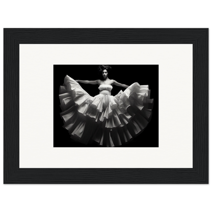 Black and white photograph of a dancer in a flowing, ruffled white dress.