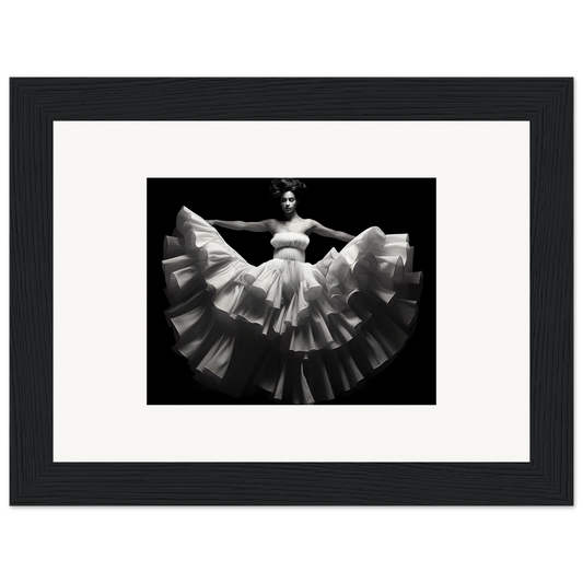 Black and white photograph of a dancer in a flowing, ruffled white dress.