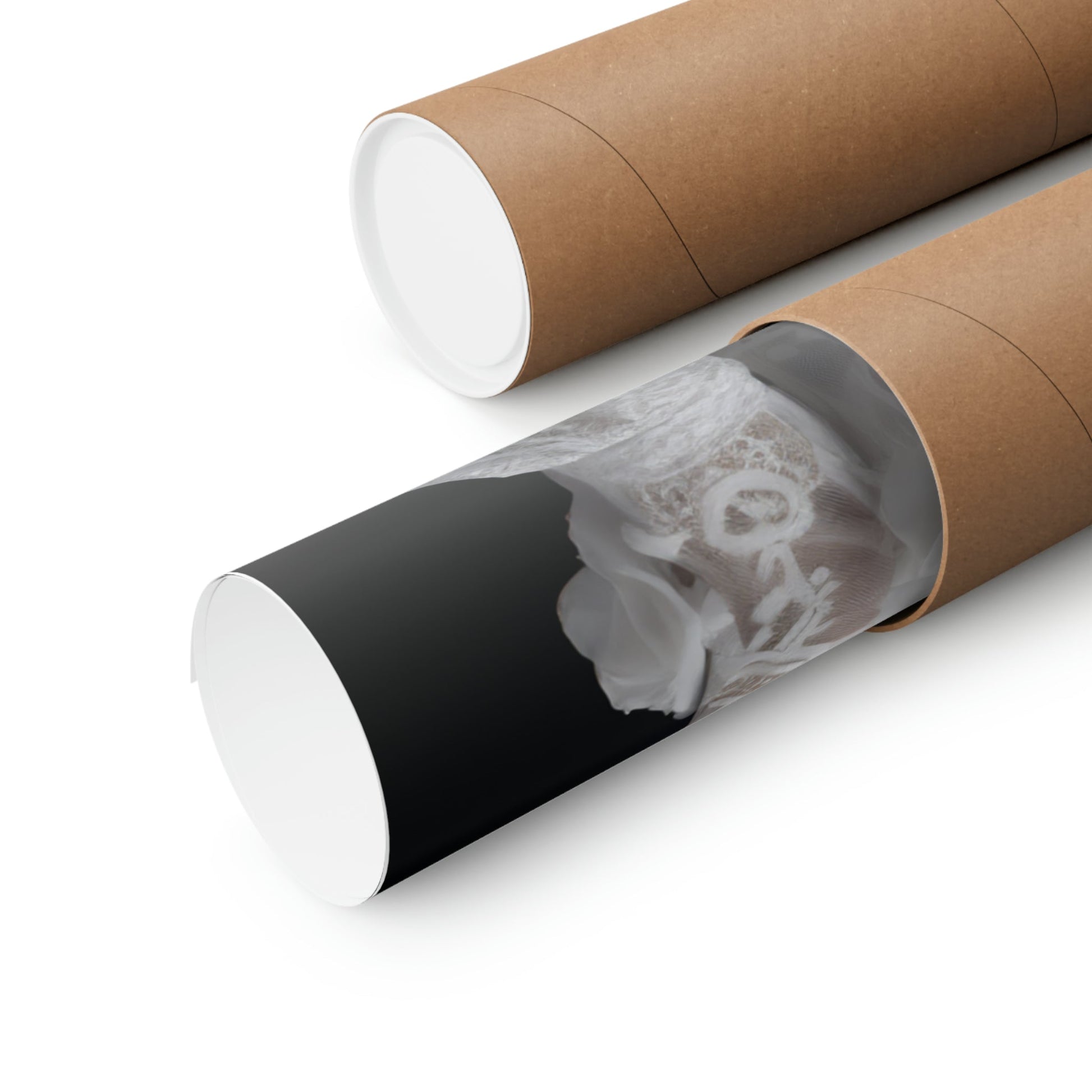 Two rolls of brown paper with a black and white photo inside