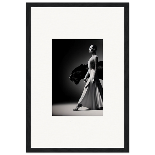 Black and white photograph of a ballet dancer in a flowing dress, striking a graceful pose.