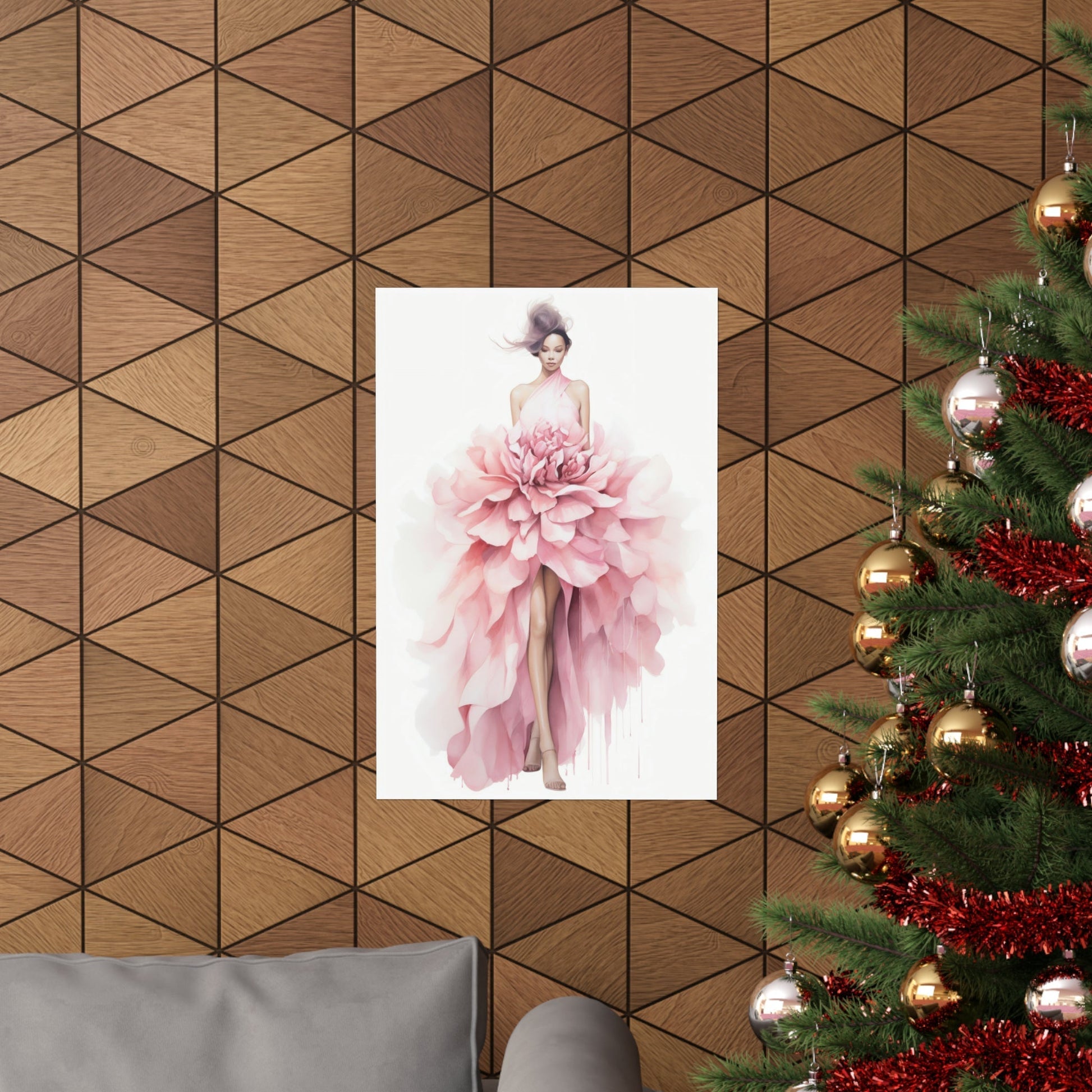 A christmas tree with a pink dress hanging on it