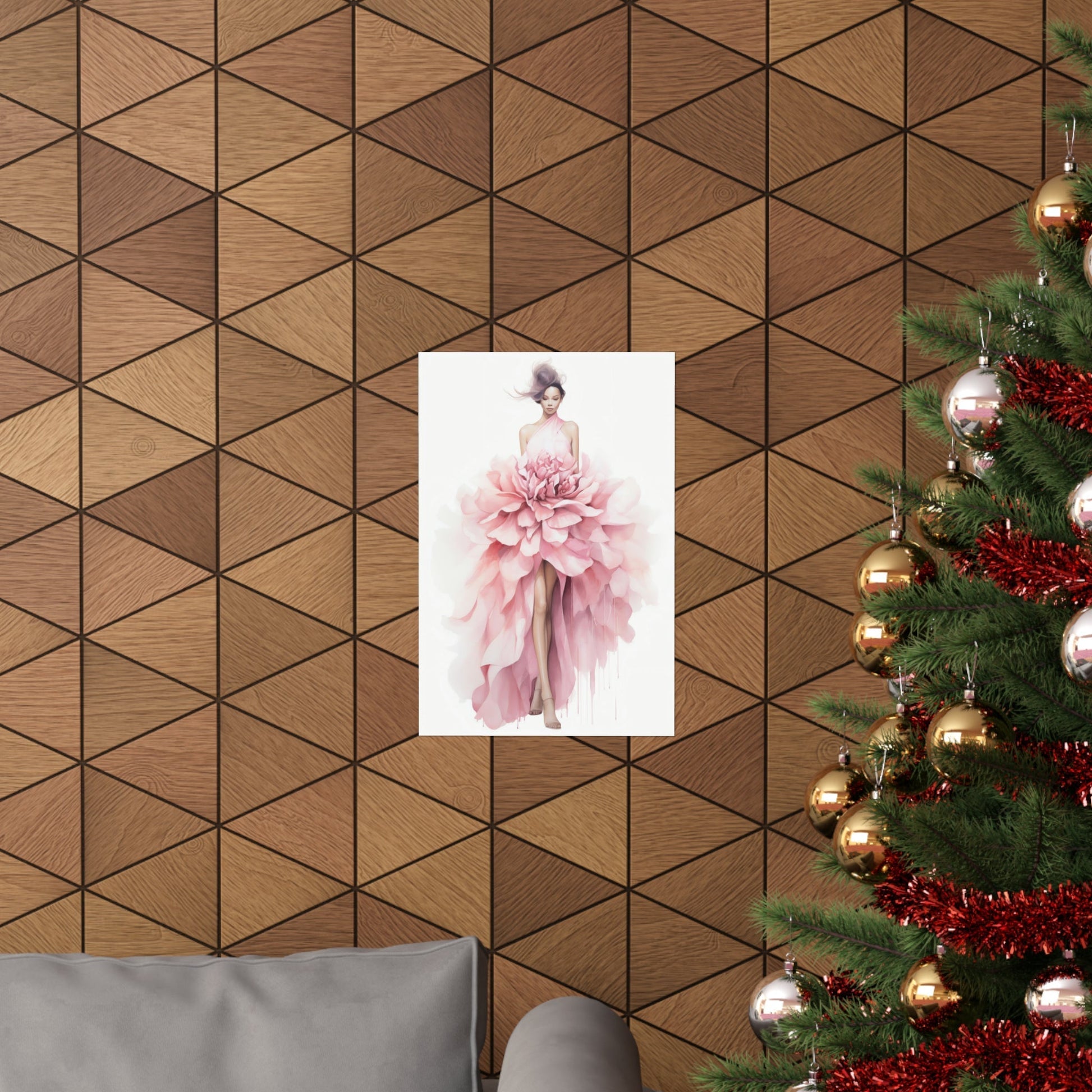 A christmas tree with a pink dress hanging on it