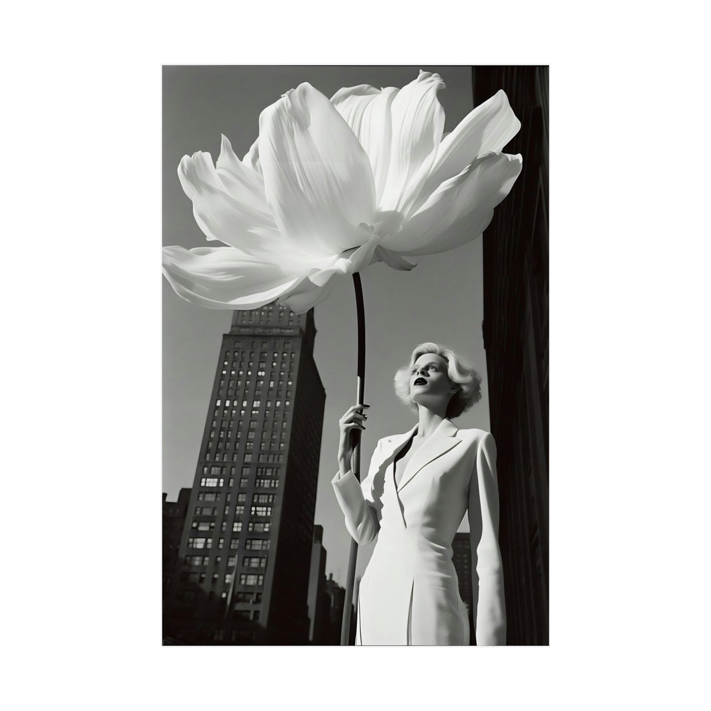 A woman in a white dress holding a large white flower