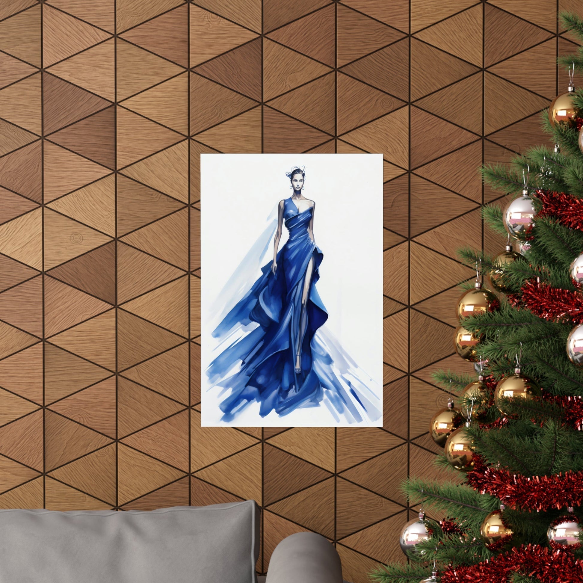 A christmas tree with a blue dress hanging on it