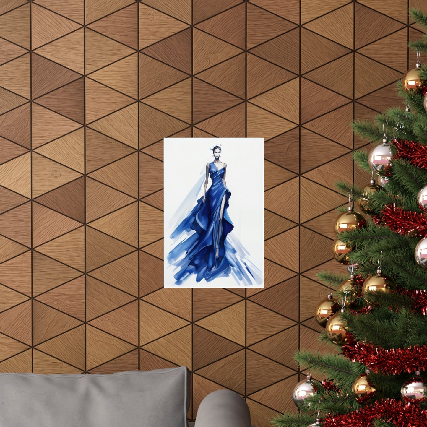 A christmas tree with a blue dress hanging on it