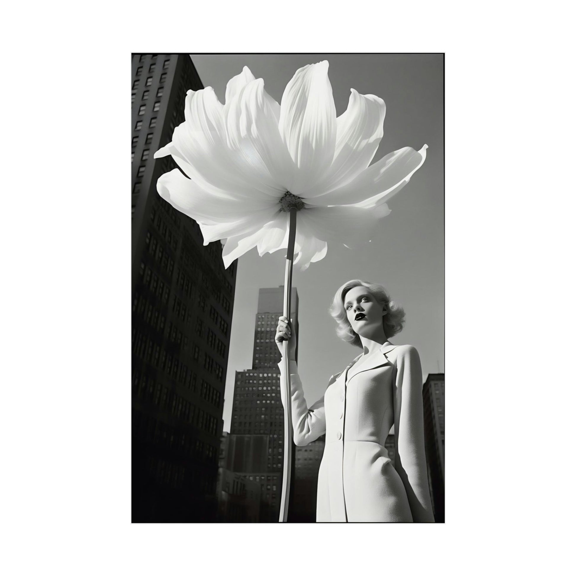 A woman holding a large white flower in her hand