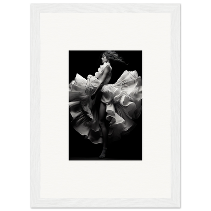 A graceful figure in flowing, billowing fabric captured in dramatic black and white.