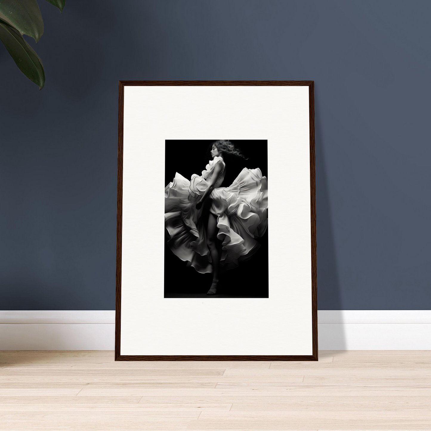 Framed black and white photograph of a dancer in flowing fabric.