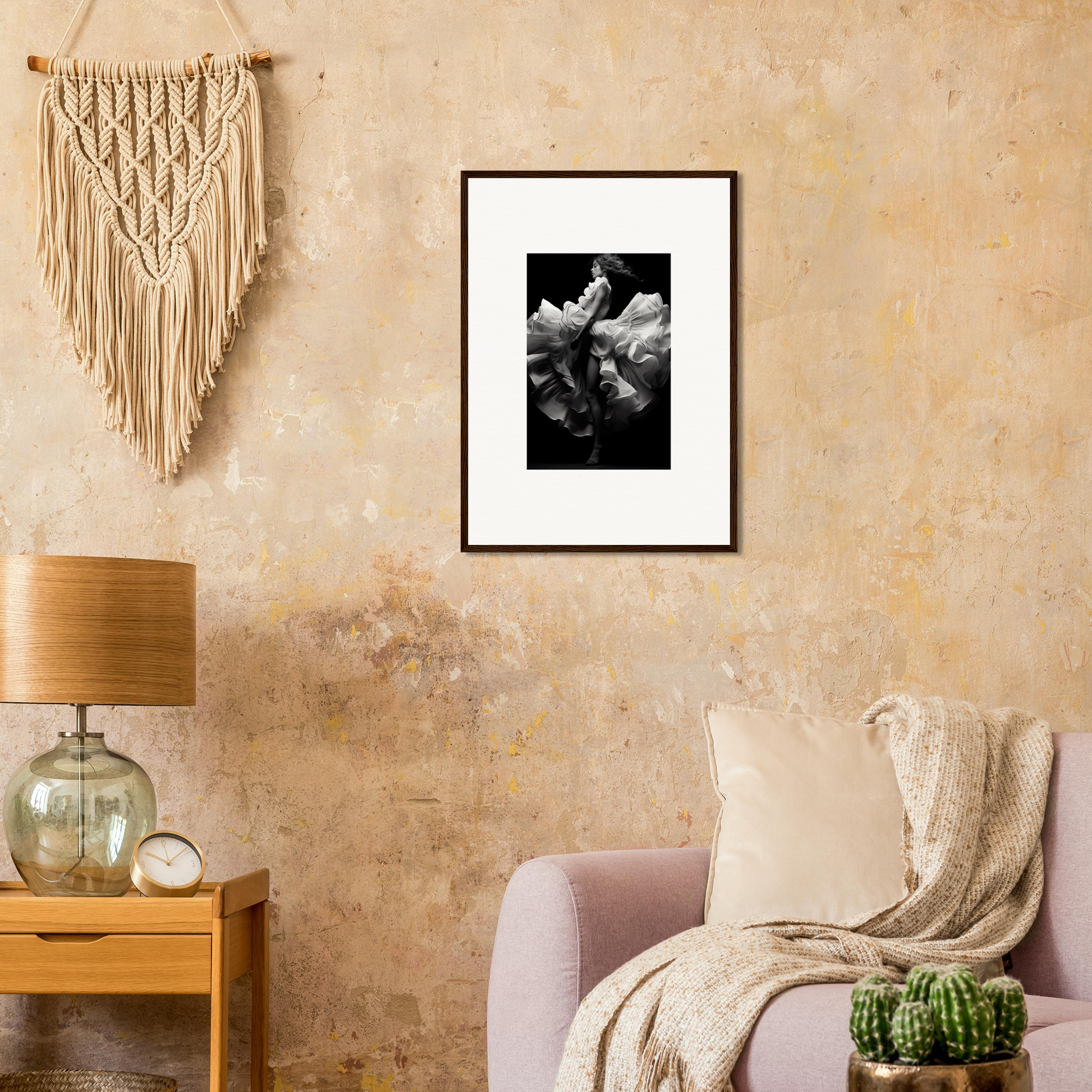 Framed black and white photograph of a flower on a textured wall.