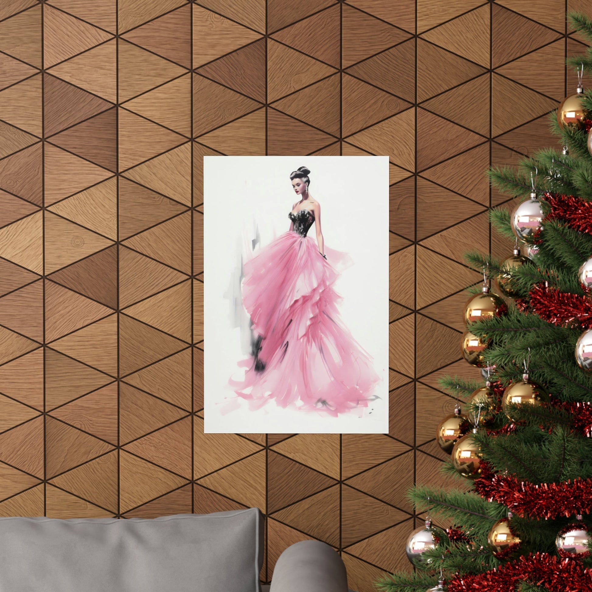 A christmas tree with a pink dress hanging on it