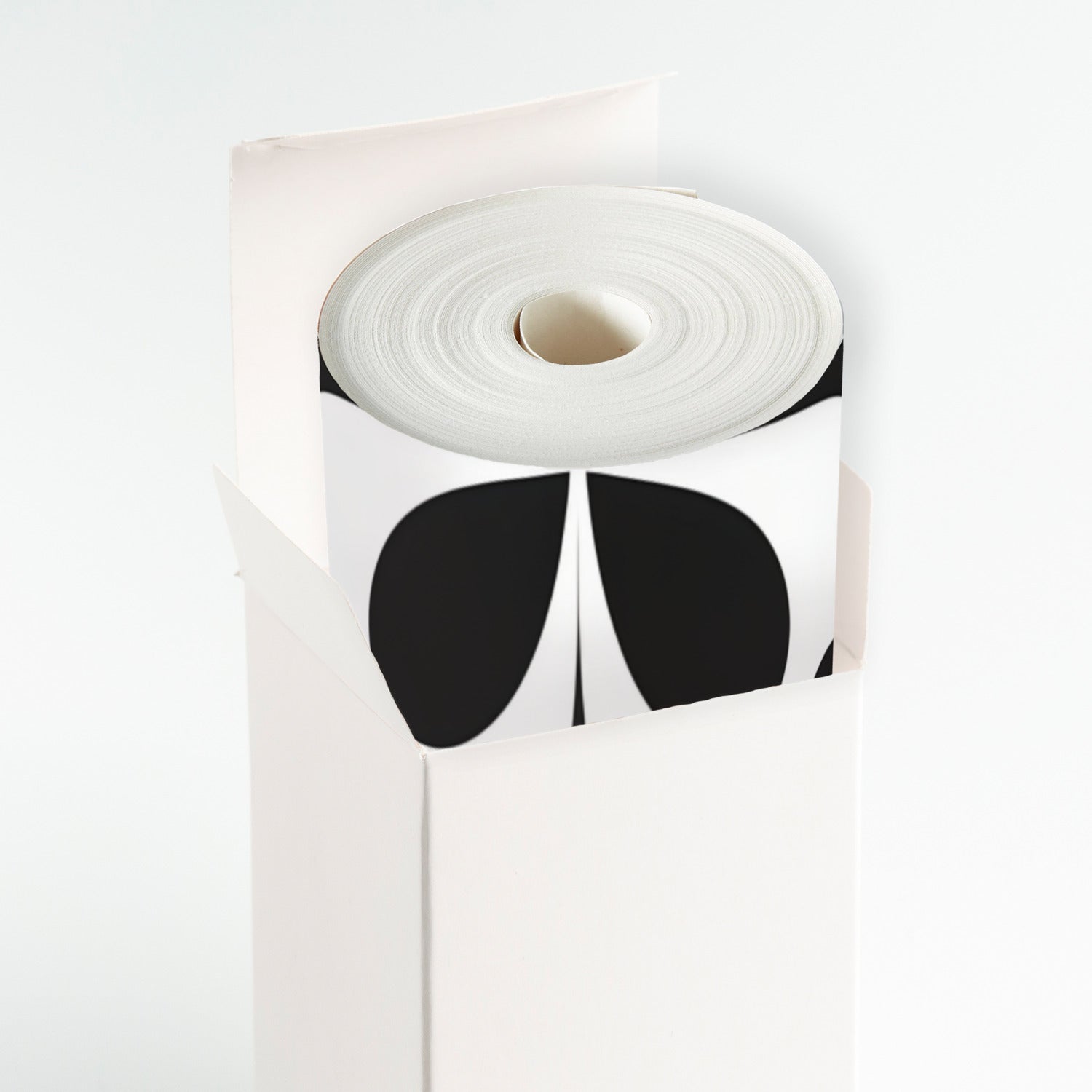 A roll of white paper with black and white designs