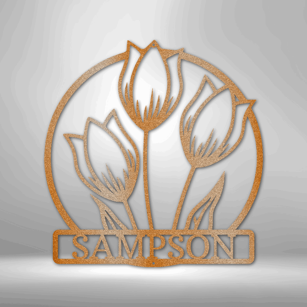 Metallic or wooden cut-out design featuring three tulip flowers above the name ’SAMPSON’ enclosed in a circular frame.