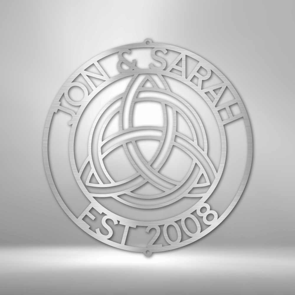 Circular emblem featuring a Celtic trinity knot design with the text ’JOIN A SARAH EST 2008’’ around the perimeter.