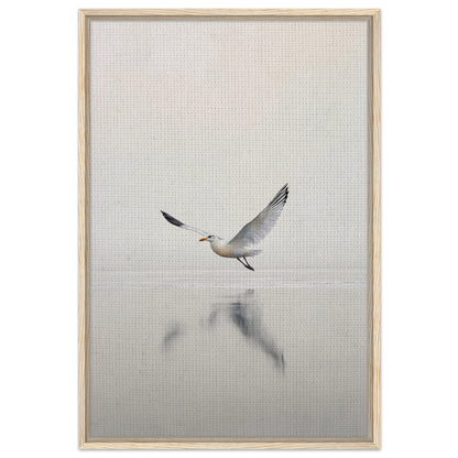 Seagull with outstretched wings flying over water in Seagull Mist Serenade framed canvas print