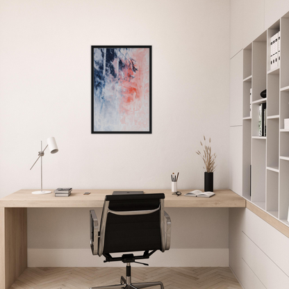 Minimalist home office with wooden desk, black chair, and exclusive framed canvas decor