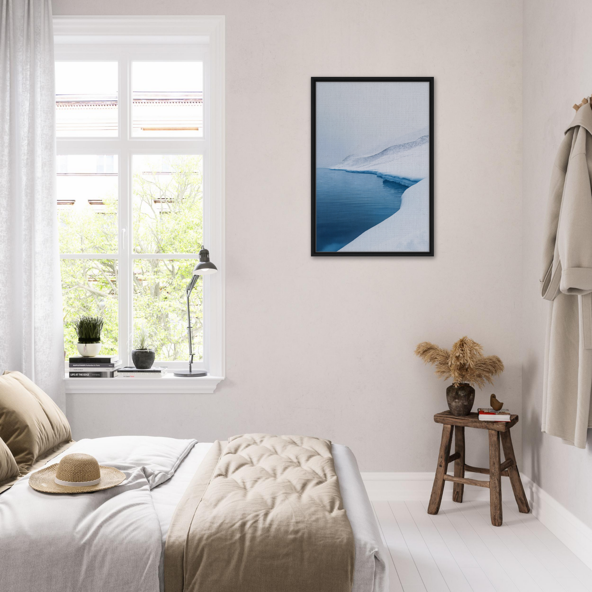 Serene bedroom featuring minimalist decor and Serene Ice Reverie framed canvas print