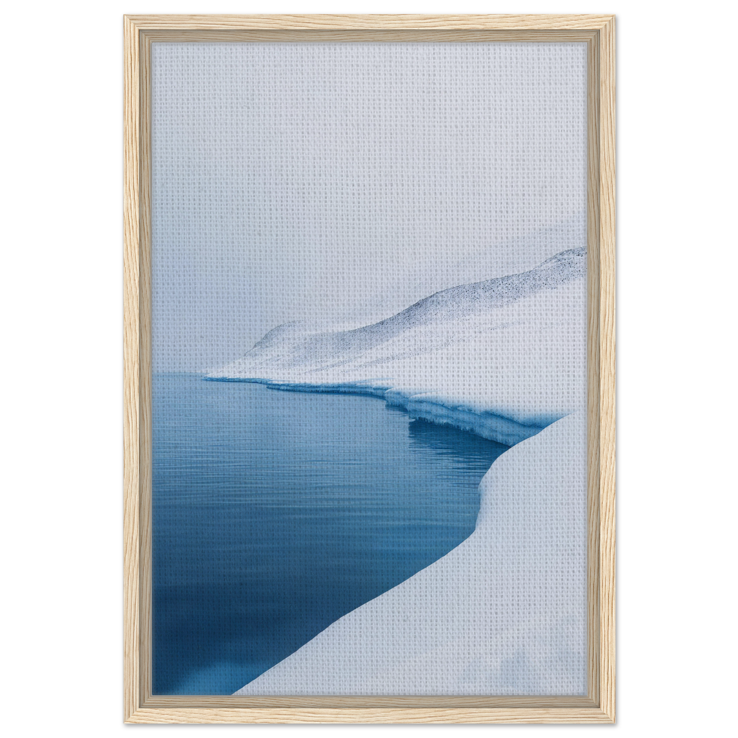 Framed canvas print of Serene Ice Reverie showcasing a snowy shoreline and calm blue water