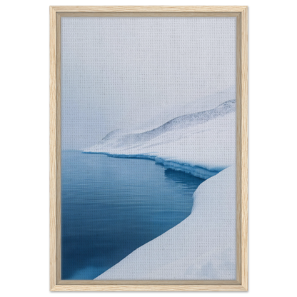 Framed canvas print of Serene Ice Reverie showcasing a snowy shoreline and calm blue water