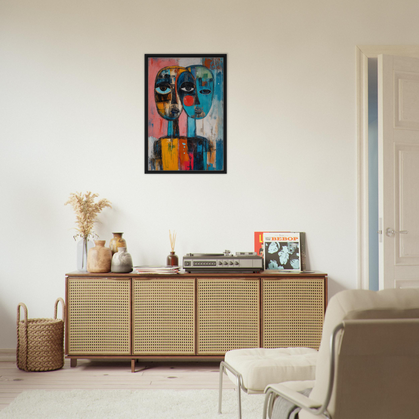 Wooden sideboard with rattan-fronted doors and decor atop Singular Mirror Maw