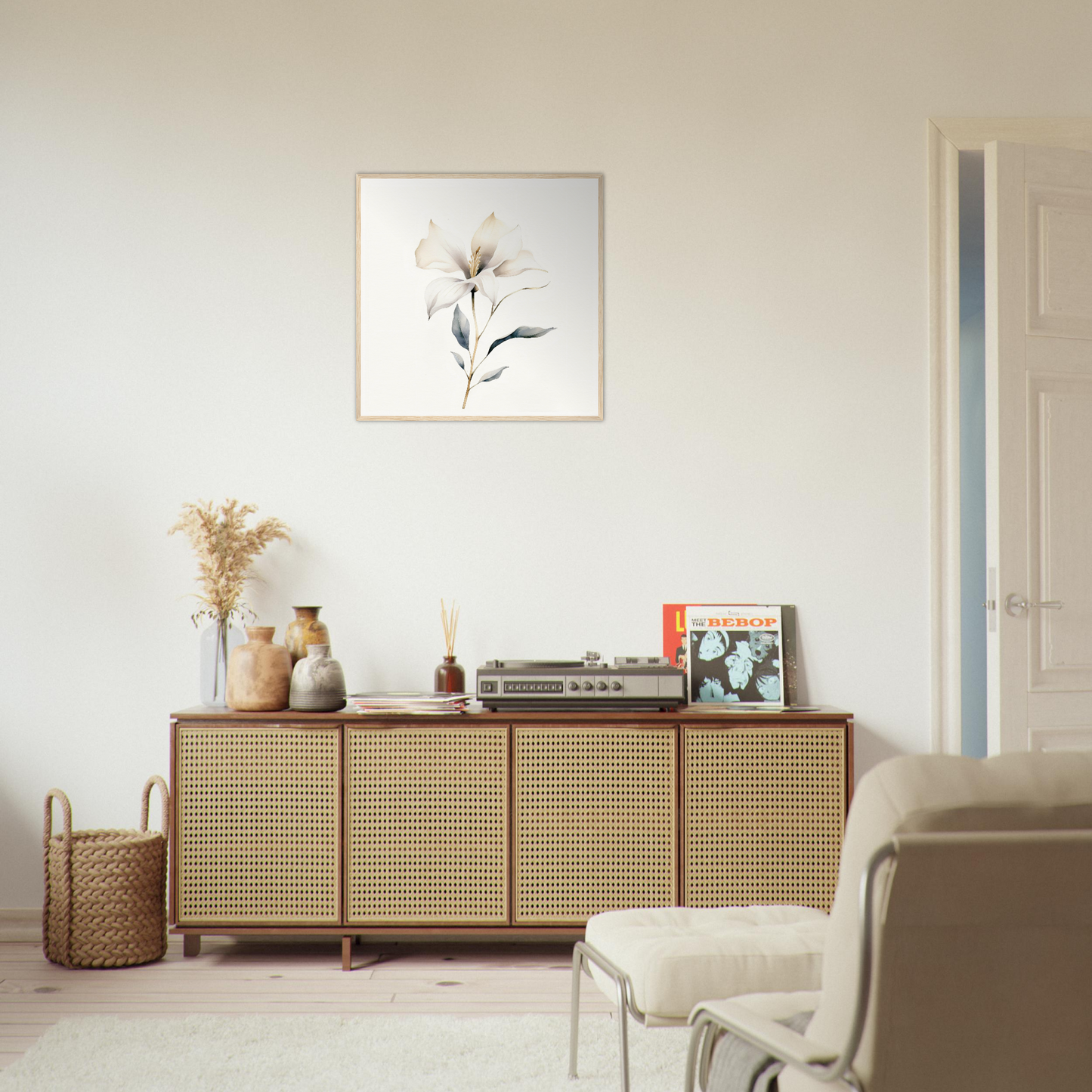 Wooden sideboard with cane-webbed doors and decorative items on top.