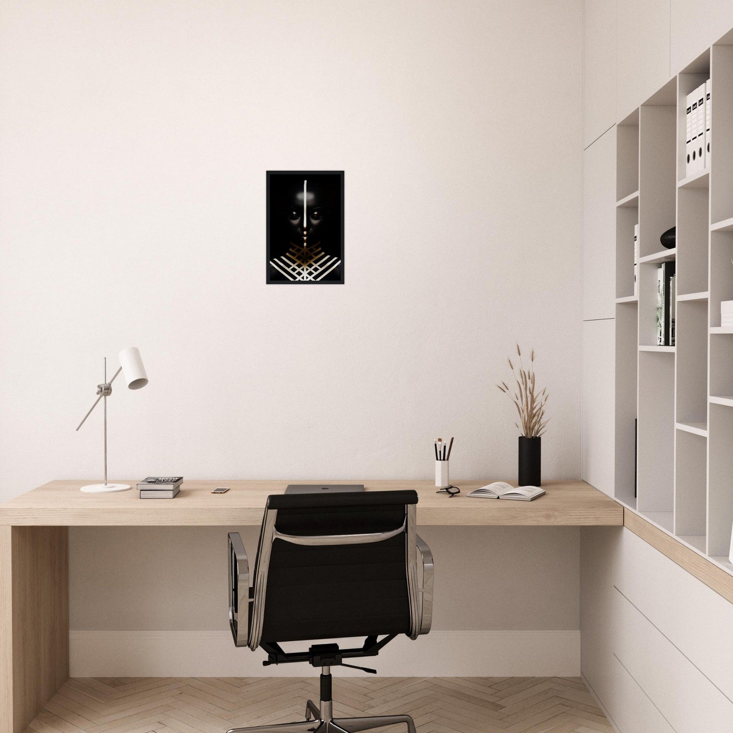 Minimalist wooden desk with a black office chair in a clean, white workspace.