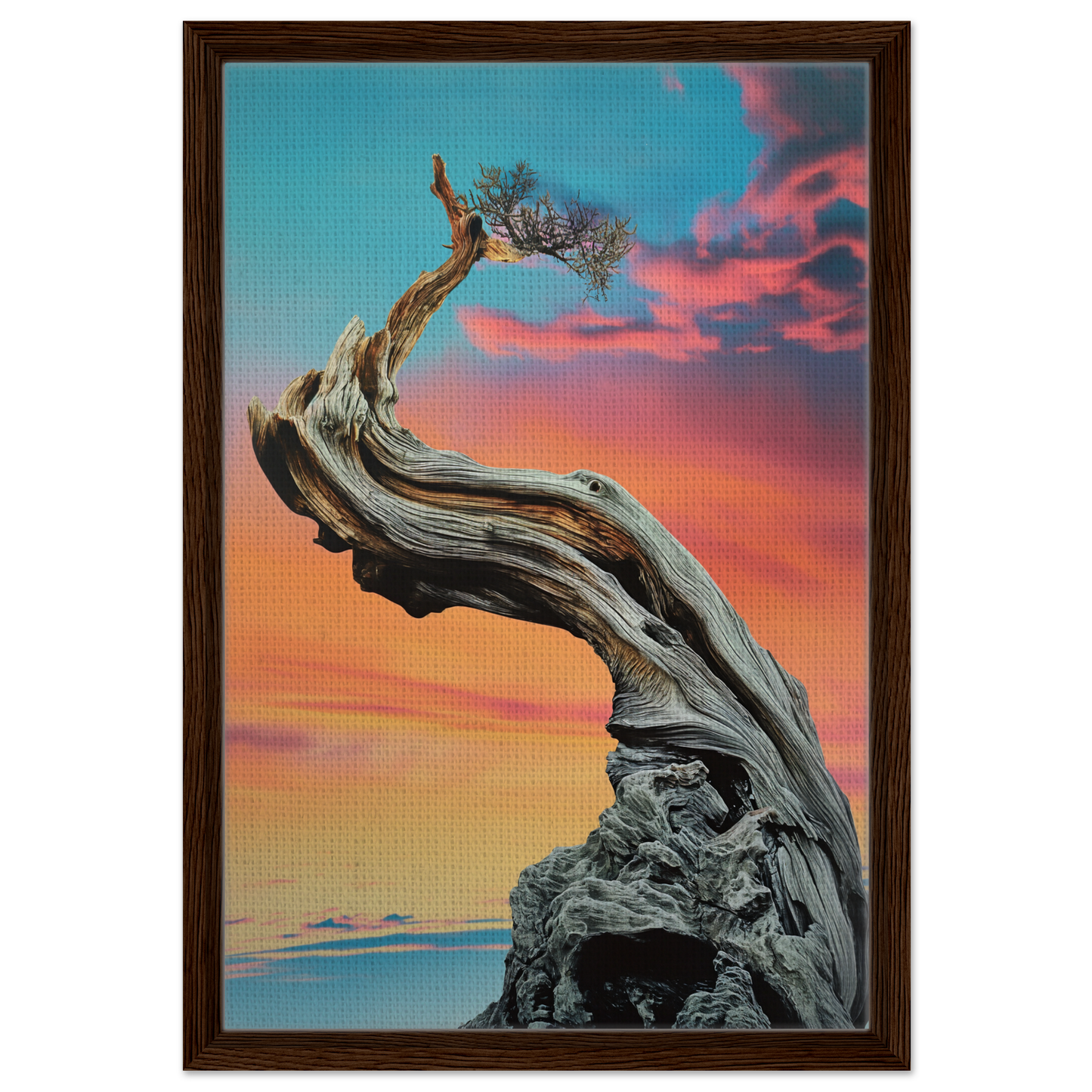 Twisted gnarled tree on rocky outcrop under colorful sky in Tangled Celestial Dawn framed canvas print