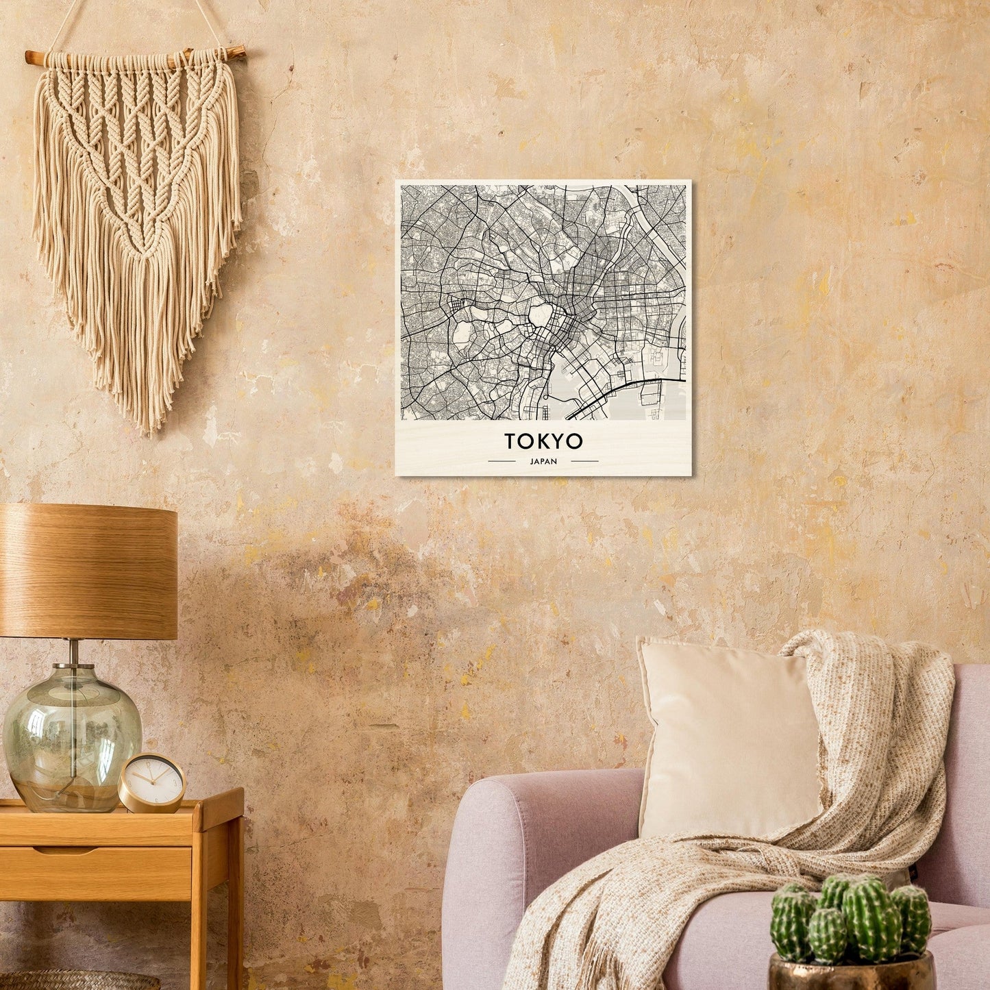 Map of Tokyo displayed as wall art alongside a macramé hanging.