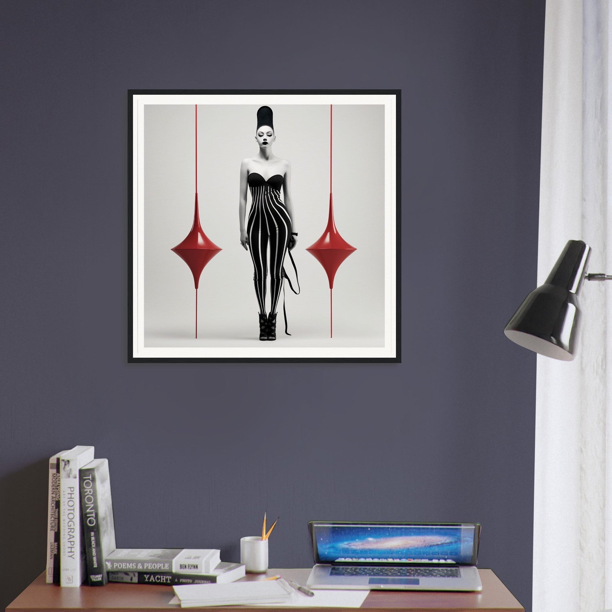 Framed artwork depicting a stylized figure in a black and white striped dress flanked by red diamond shapes.