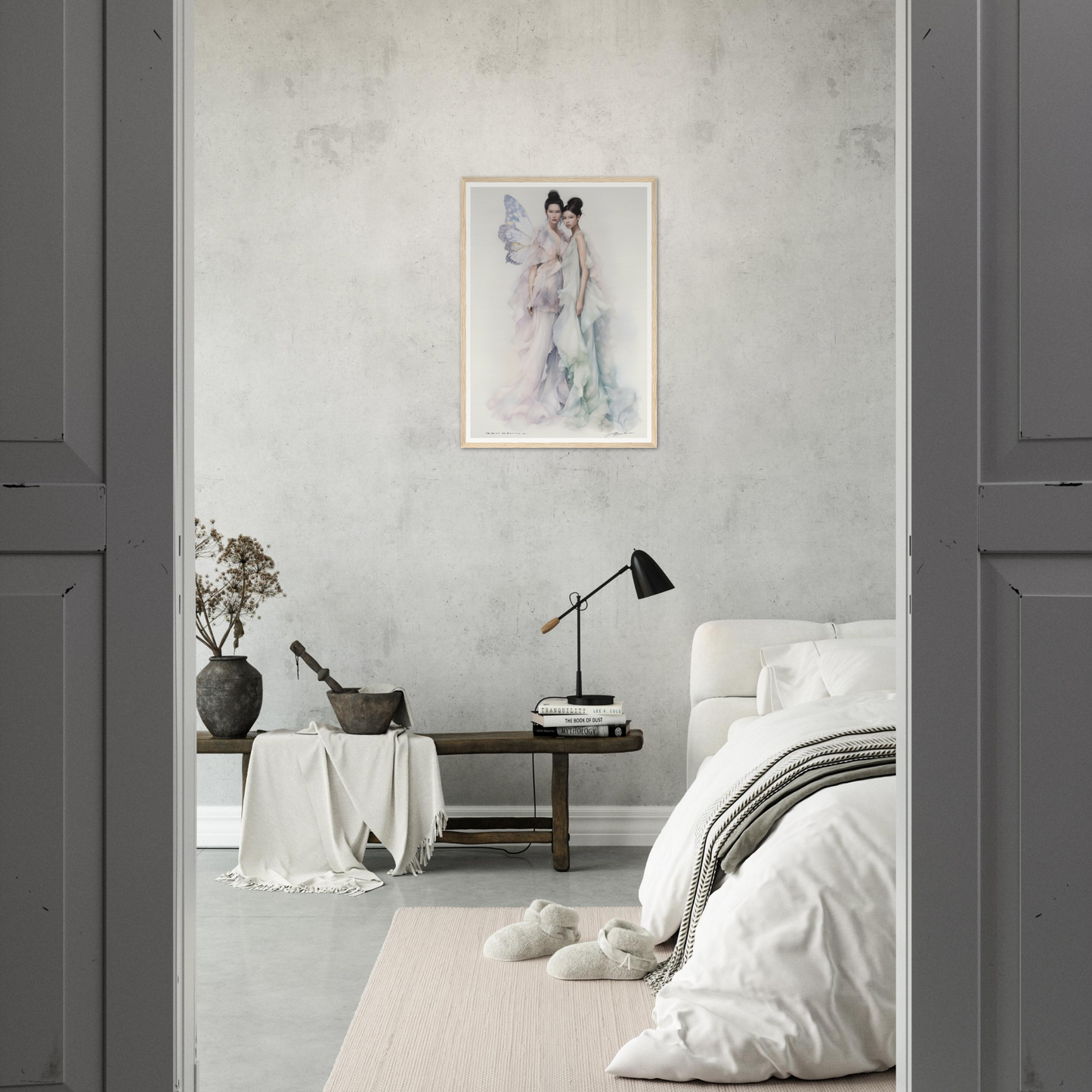 Minimalist bedroom with a monochromatic white and gray color scheme.