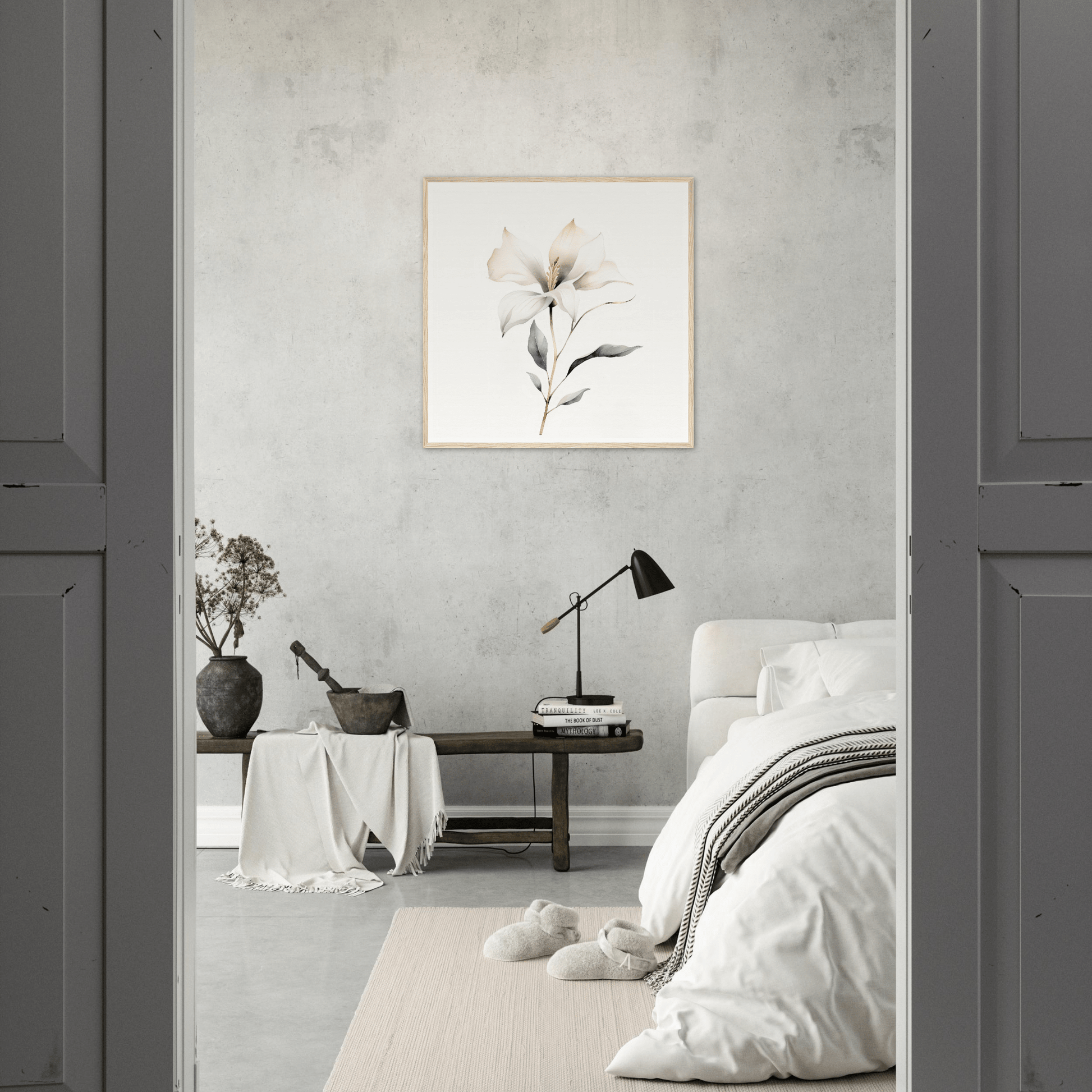 Minimalist bedroom with neutral color palette and floral wall art.