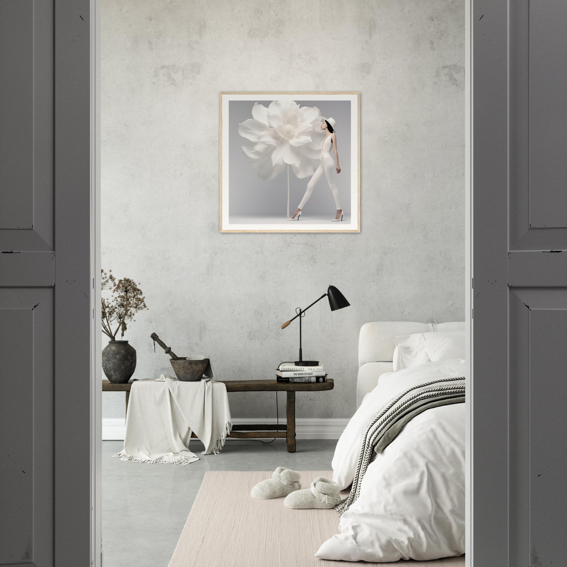 Minimalist bedroom with a monochromatic gray and white color scheme.