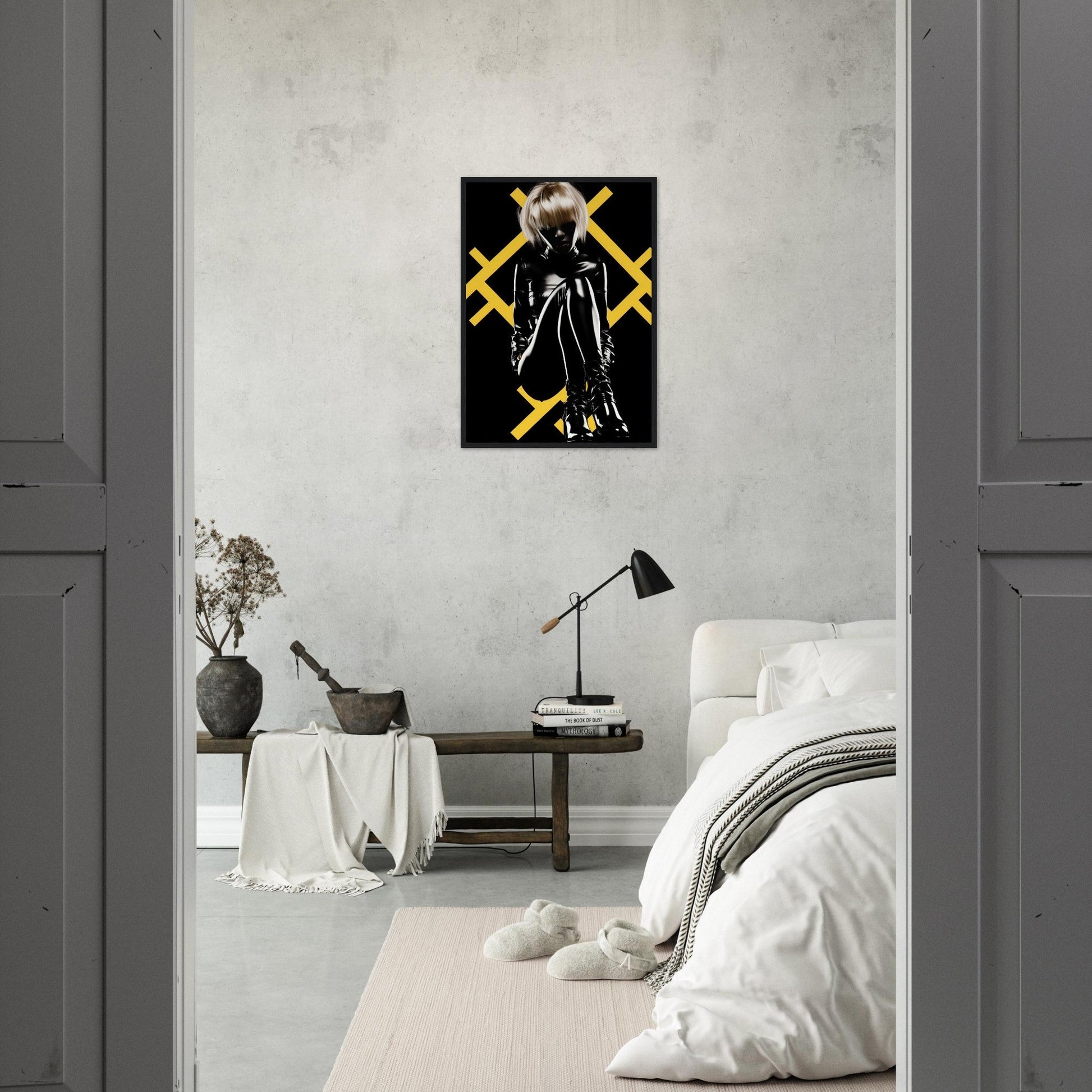 Minimalist bedroom with a striking black and yellow artwork featuring a hooded figure on the wall.