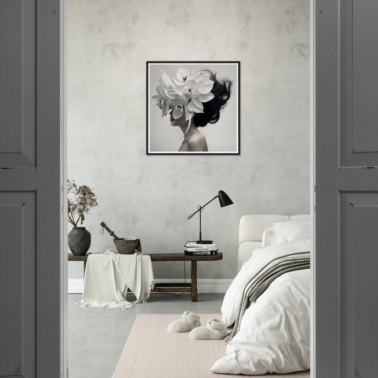 Monochromatic bedroom with minimalist decor and a striking floral portrait on the wall.