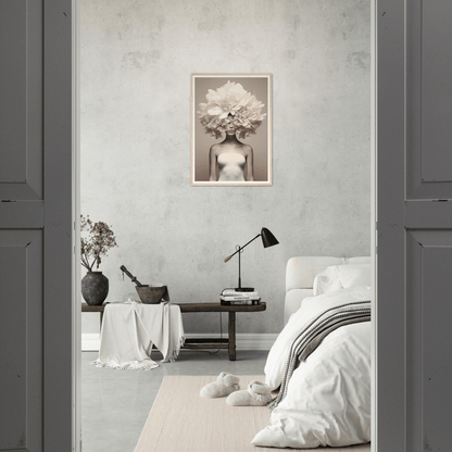 Monochrome bedroom interior with minimalist decor and a striking artistic photograph on the wall.