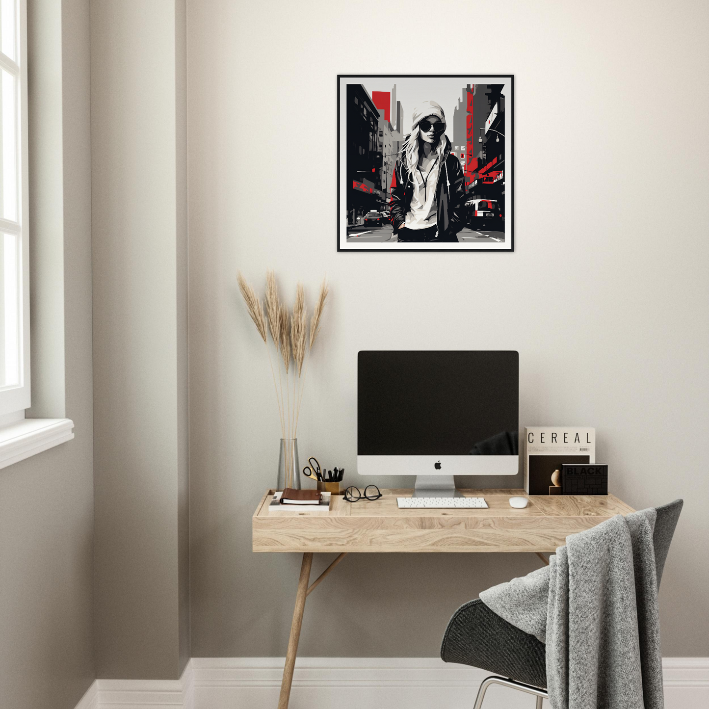 Minimalist home office with iMac and Urban Spirit Redux framed posters on wooden desk