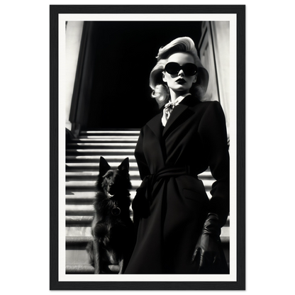 Black and white photograph of a stylish woman in sunglasses and a dark coat standing next to a dog on stairs.