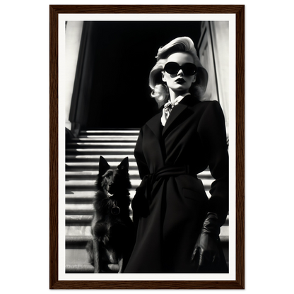 Black and white photograph of a stylishly dressed woman with sunglasses standing next to a dark-colored dog.