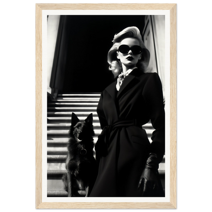 Black and white photograph of a stylishly dressed woman with sunglasses standing next to a dark-colored dog on stairs.