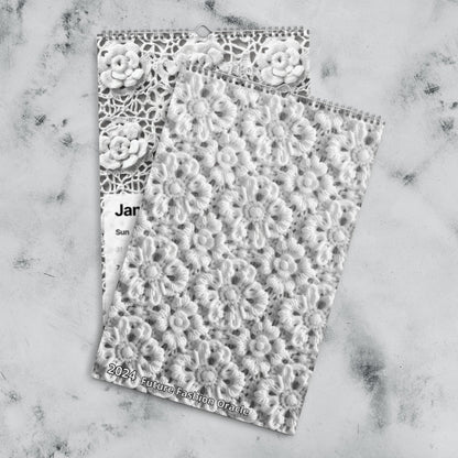 Intricate lace-like paper or fabric sheets with floral patterns.