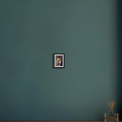 Framed photograph of a person hanging on a teal wall.