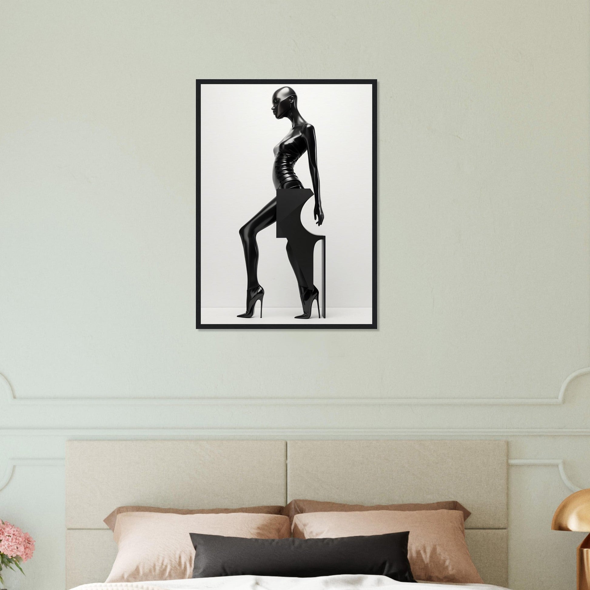 Black and white framed artwork depicting a stylized silhouette of a woman in a fashionable pose.