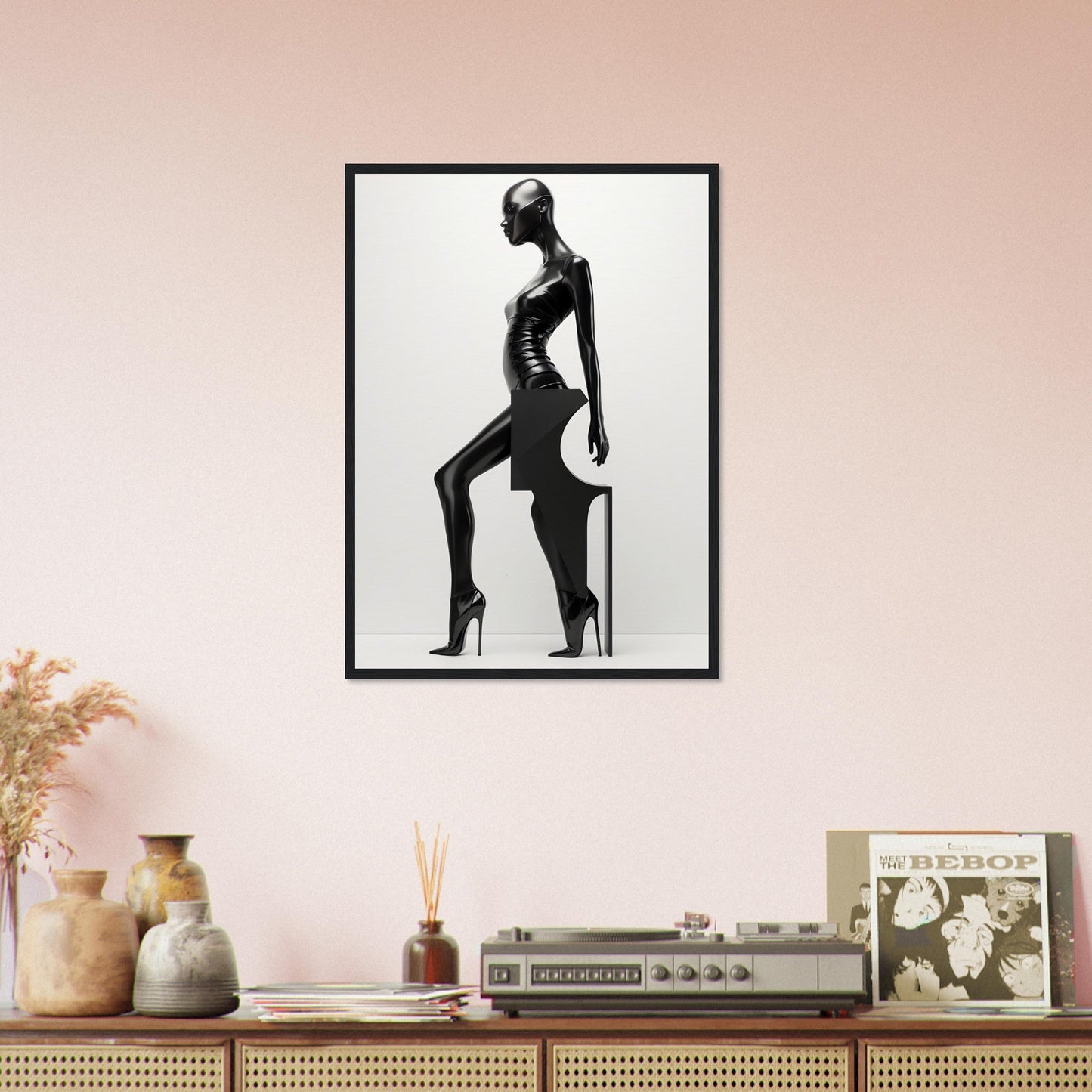 Framed black and white silhouette artwork of a stylized female figure in a striking pose.