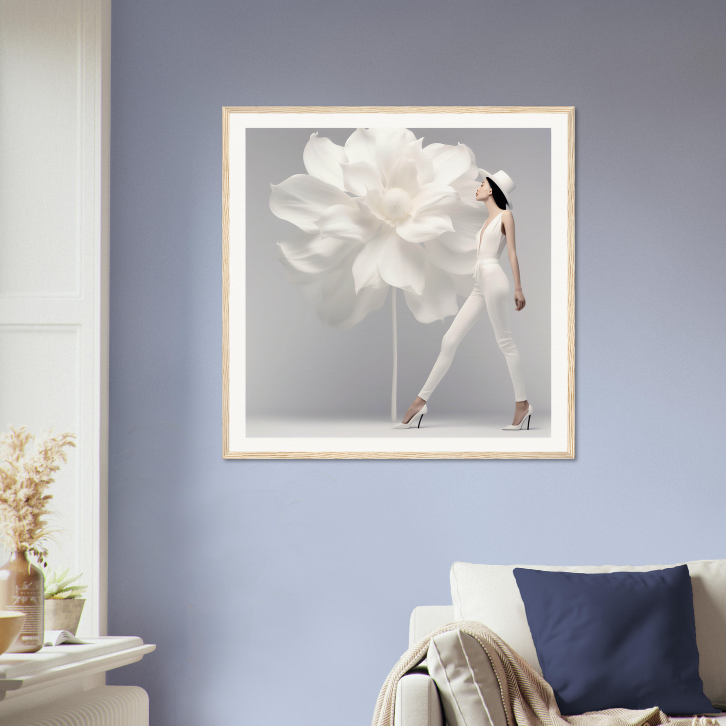 Framed artwork depicting a figure with a giant flower as a dress or skirt.